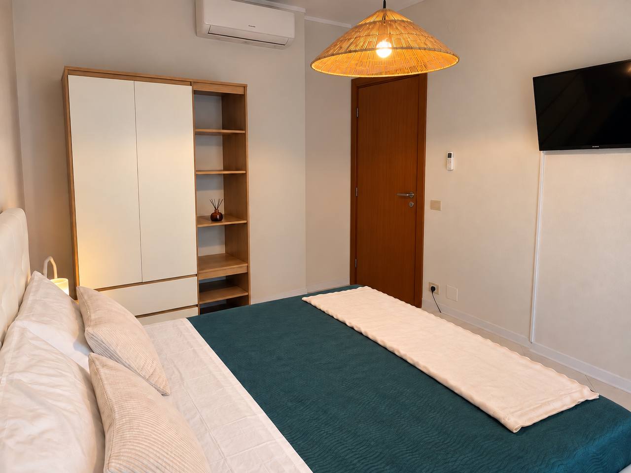 Double bedroom with TV and wardrobe